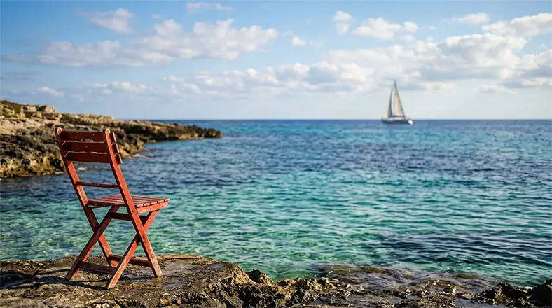 fotografia e mindfulness una vecchia sedia rossa su una scogliera